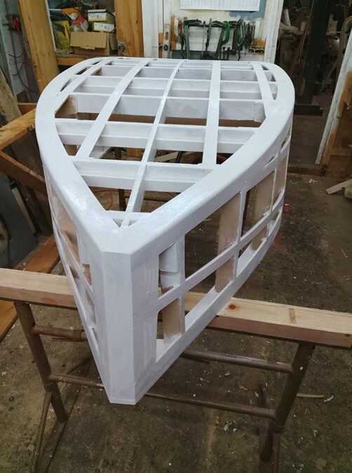Waterproof name stickers being layered over the boat frame