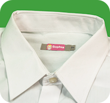 An iron-on name label bonded into a garment