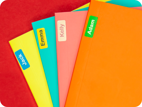 Notebooks with name labels on them
